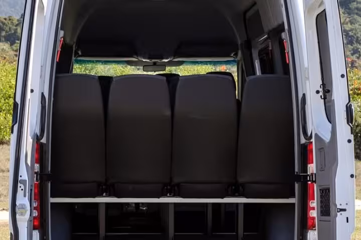 Interior view of a spacious shuttle van used for shared transfers from Paraty to São Paulo, highlighting ample seating.