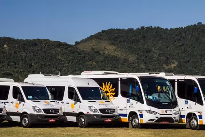 Fleet of Paraty Tours shuttles ready for shared transportation service to São Paulo.