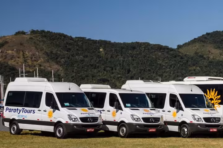 Fleet of Paraty Tours transfer vans ready for shared transport from Paraty to hotels in Rio de Janeiro.