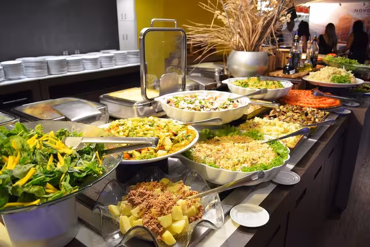 Fresh Portuguese salad buffet spread at a folklore themed dinner experience, Jantar Folclórico Temático