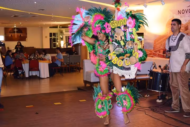Colorful samba-style performer entertaining guests during Folklore Themed Dinner Jantar Folclórico Temático