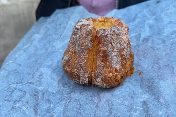 Sugar-crusted Paris canelé pastry close-up, classic French dessert on food, wine and cheese tasting tour