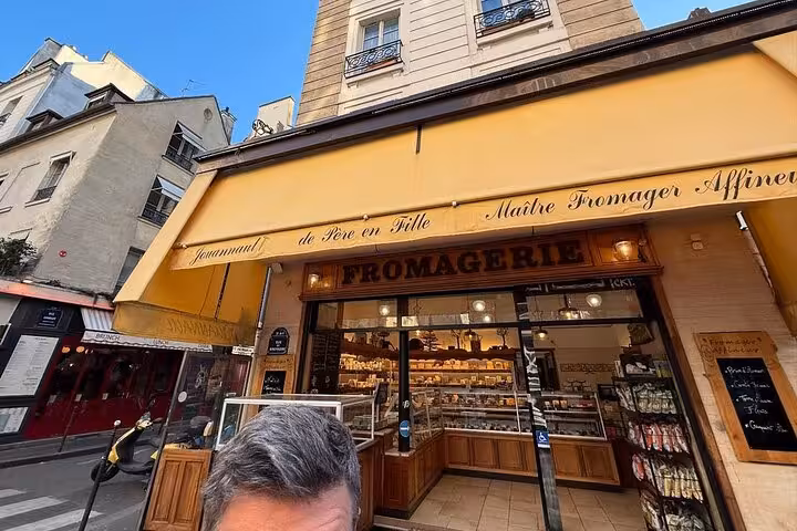 Paris fromage shop stop on food, wine and cheese tasting tour with Napoleon love story in Le Marais