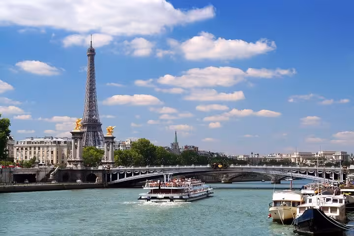 Eiffel Tower and Seine hop-on hop-off cruise boats, included with Full Day Paris City Pass museum entry