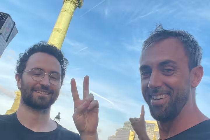 Two friends posing at Place de la Bastille, Paris Marais self-guided scavenger hunt and walking tour fun