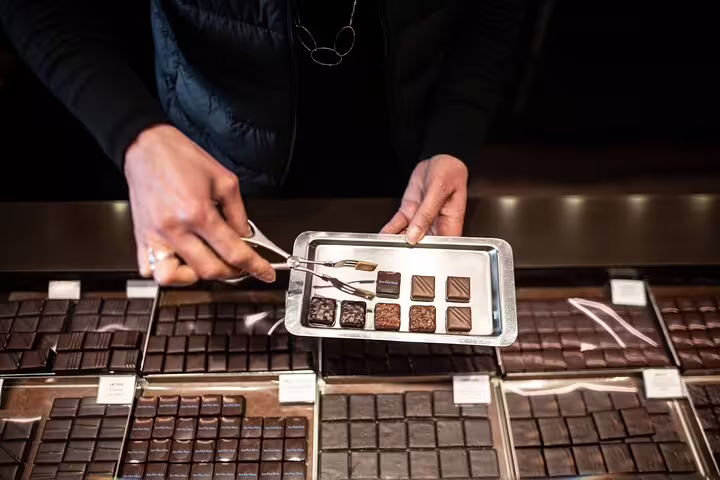 Explore exquisite Parisian chocolates in a gourmet shop on the Paris Gourmet Tour Wine and Fromage Adventure.