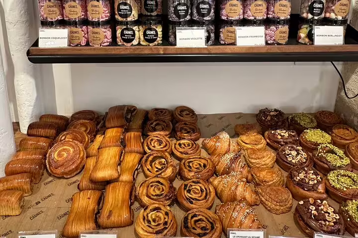 Assortment of fresh pastries and sweets displayed in a Parisian bakery for the Paris Gourmet Tour.