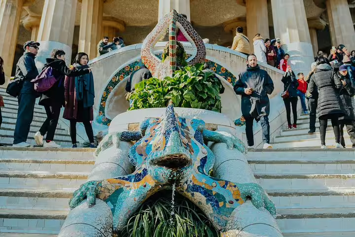 Colorful mosaic lizard sculpture at Park Güell, a highlight of the Barcelona city tour.