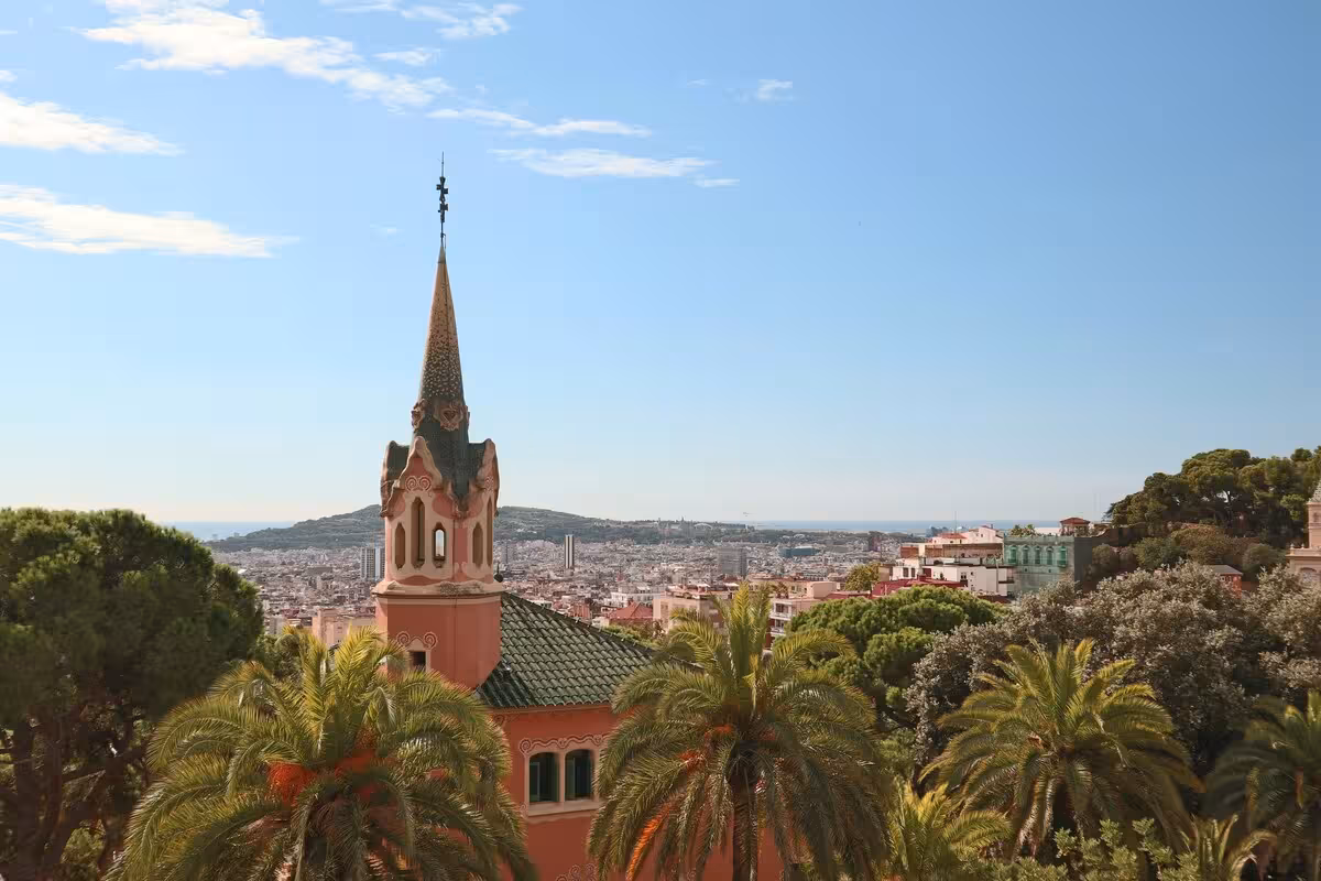Park Güell viewpoint with Gaudí pavilion and Barcelona skyline on UNESCO tour with skip-the-line tickets