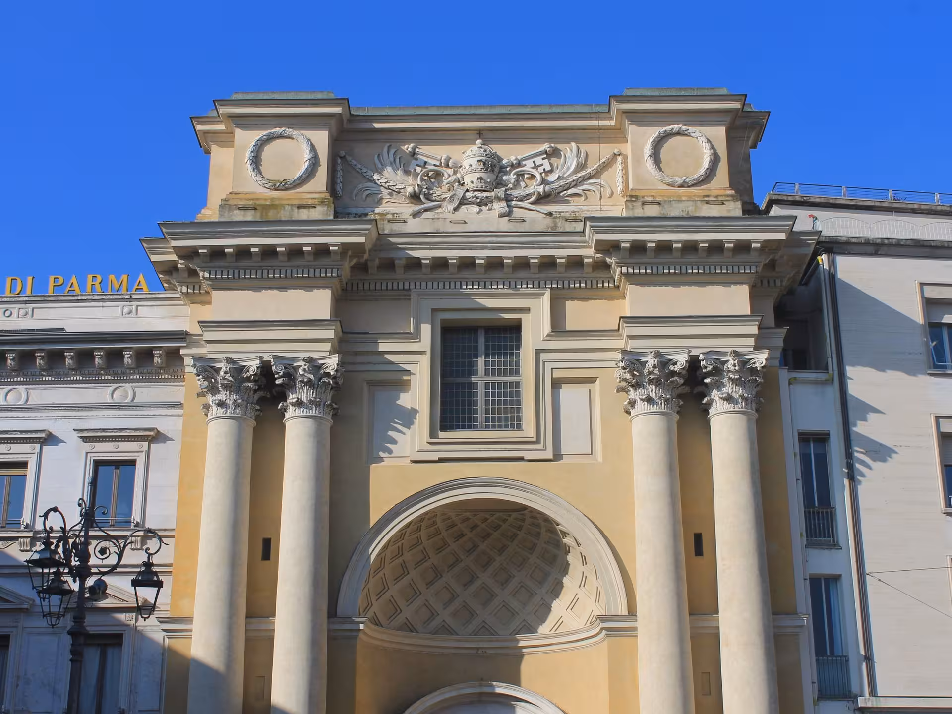 Neoclassical architecture of a historic building in Parma, Italy, perfect for cultural sightseeing tours.