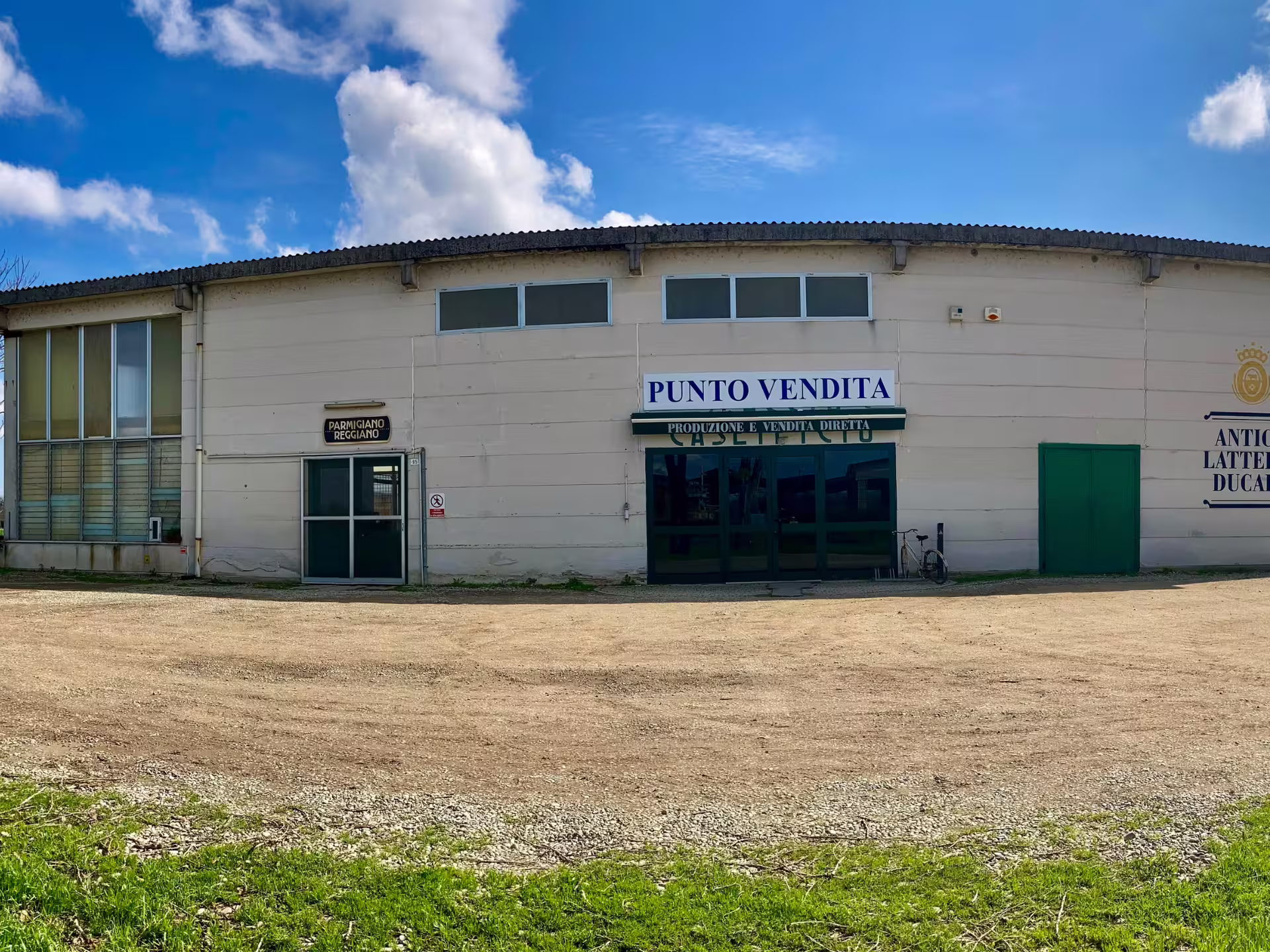 Exterior of Parmigiano Reggiano dairy shop near Modena, meeting point for parmesan cheese tour and tasting
