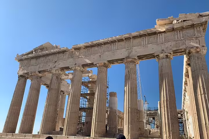 Parthenon columns on the Acropolis in Athens under blue sky, stop on a half-day private car tour with local