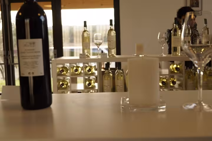 Tasting room table with wine bottles and glassware at Pce’s Vineyard sommelier course and food pairing