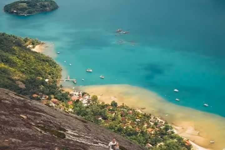 Stunning aerial view of turquoise waters and lush greenery at Peak Sugar Bread, a must-visit adventure attraction.