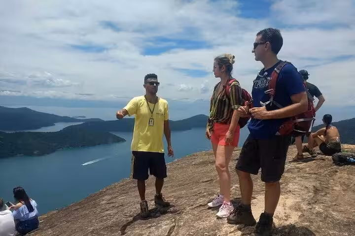 Guided hikers enjoy breathtaking views at Peak Sugar Bread, a top adventure destination with stunning landscapes.