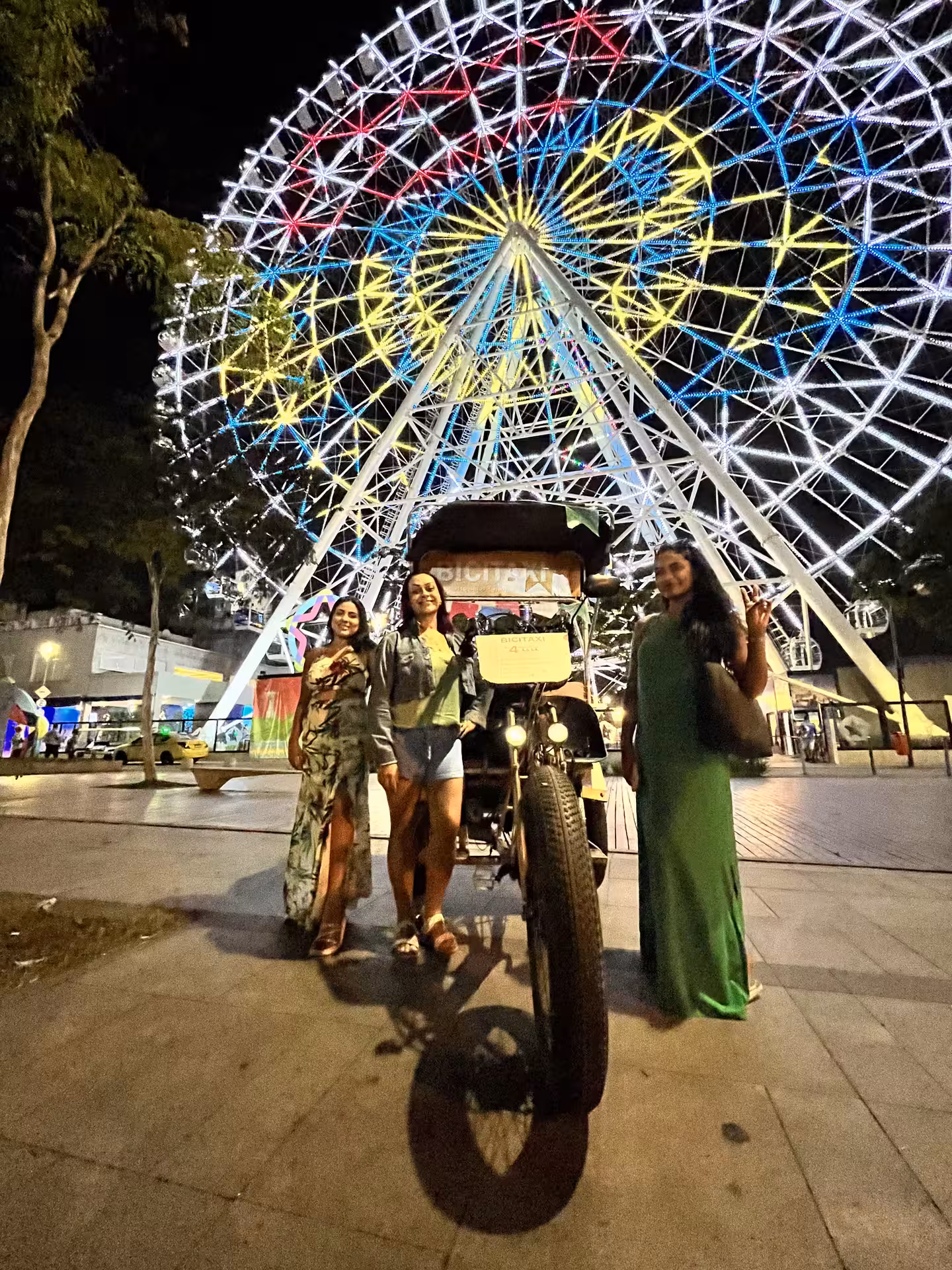 Pedicab photo stop at Rio Star Ferris wheel at night, Rio de Janeiro historical city centre pedicab tour