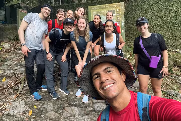Group of hikers ready to embark on the exciting Pedra da Gávea trail in Rio's lush forest setting.