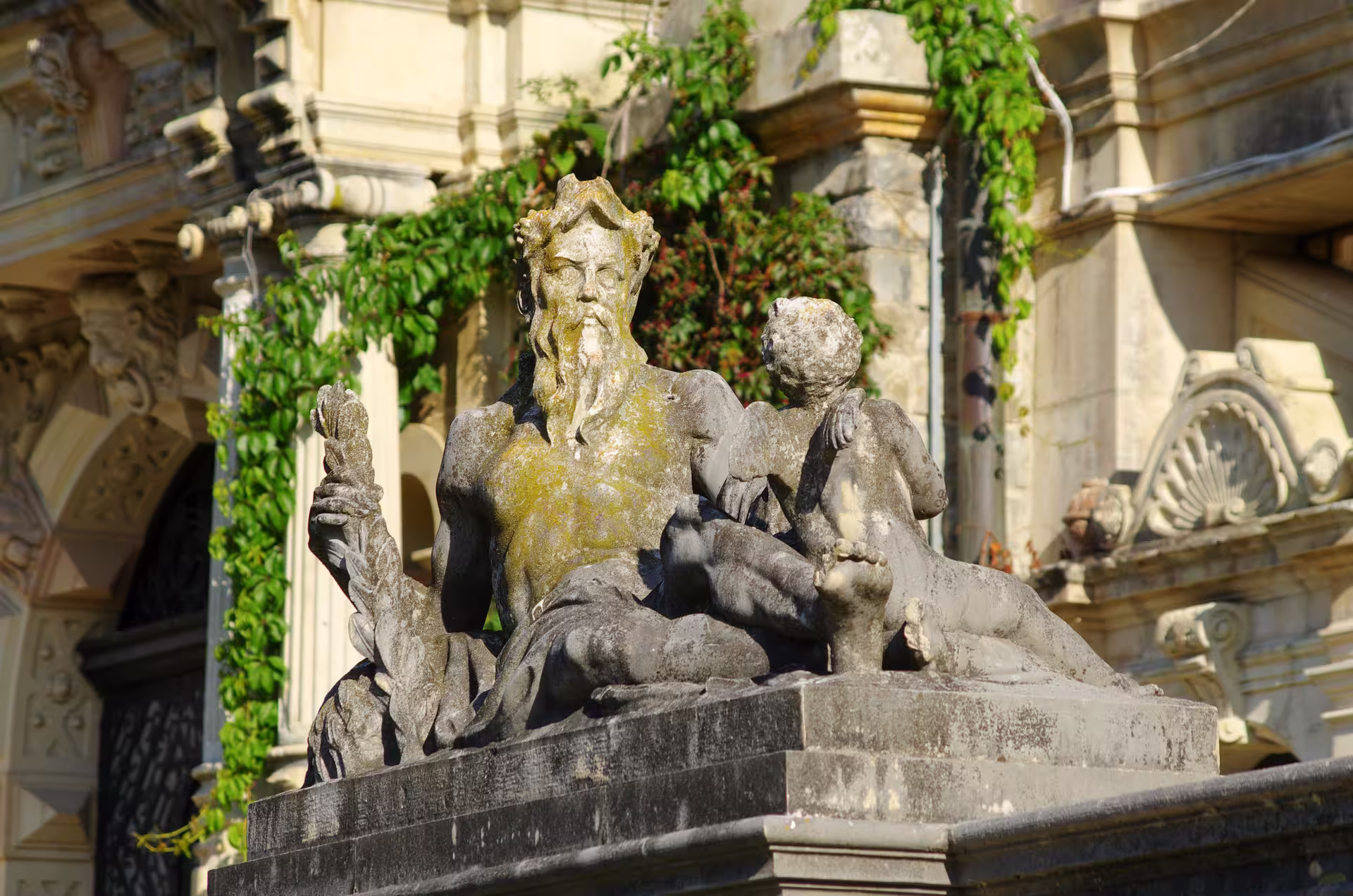 Close-up of a detailed stone statue at Peles Castle, capturing the intricate craftsmanship and historical allure.