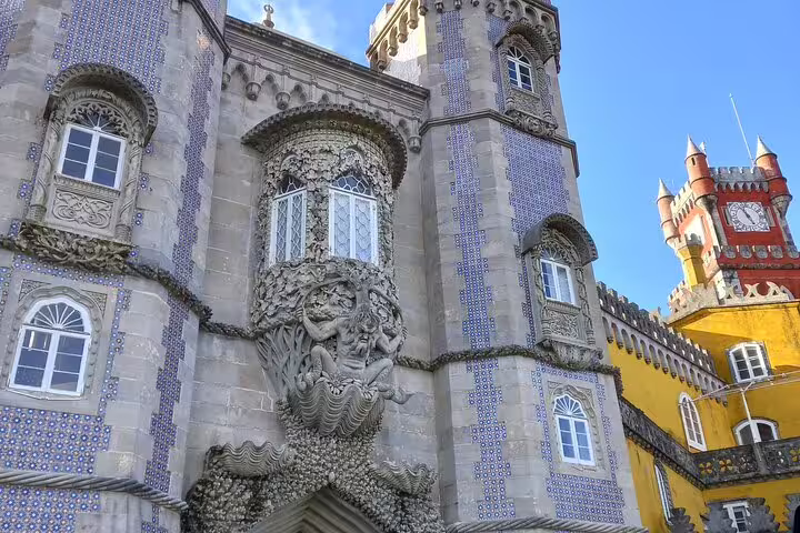 Close-up of decorative facade at Pena Palace, showcasing intricate designs on the Private Fatima Sintra Tour from Lisbon or Cascais.