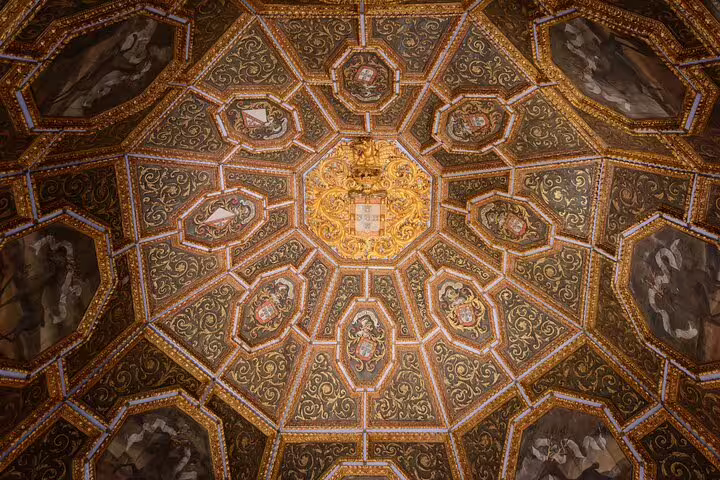 Intricate, golden geometric ceiling design at Pena Palace in Sintra, showcasing ornate artistry on a full-day Lisbon tour.