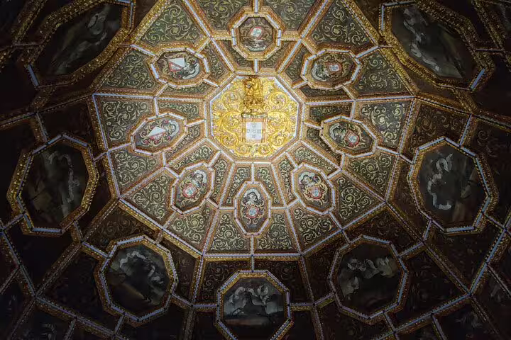 Ornate ceiling detail from Sintra's Pena Palace, showcasing intricate designs on a private tour from Lisbon to Regaleira.