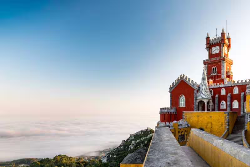 Majestic Pena Palace in Sintra with panoramic views, a highlight of the Sintra & Cabo da Roca private van tour.