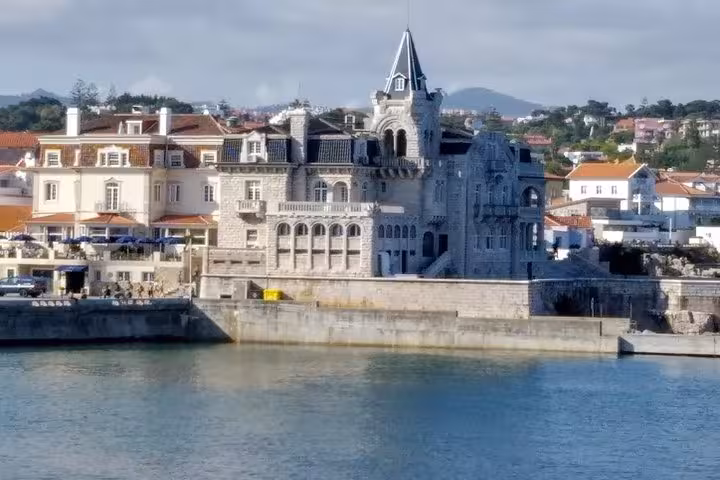 Historic mansion overlooking the serene Cascais waterfront, a highlight of the exclusive Sintra and Cascais tour.