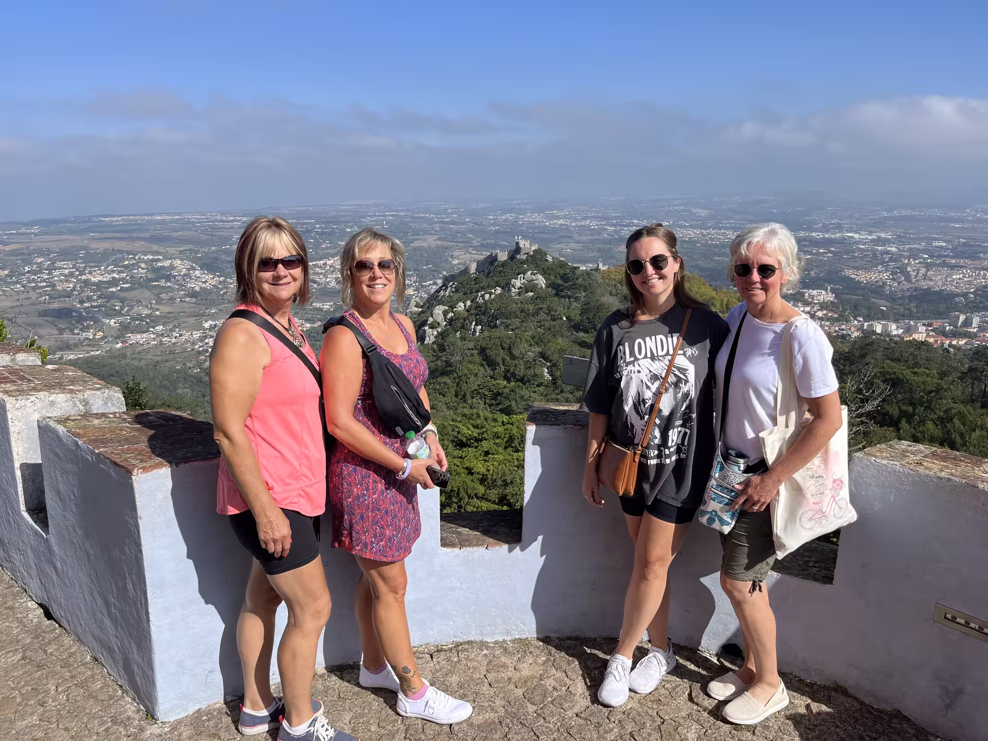Visitors enjoying a panoramic view from the walls of Pena Palace during a half-day Sintra tour.
