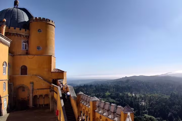 Explore the vibrant architecture and breathtaking views of Pena Palace in Sintra on a private tour from Lisbon.