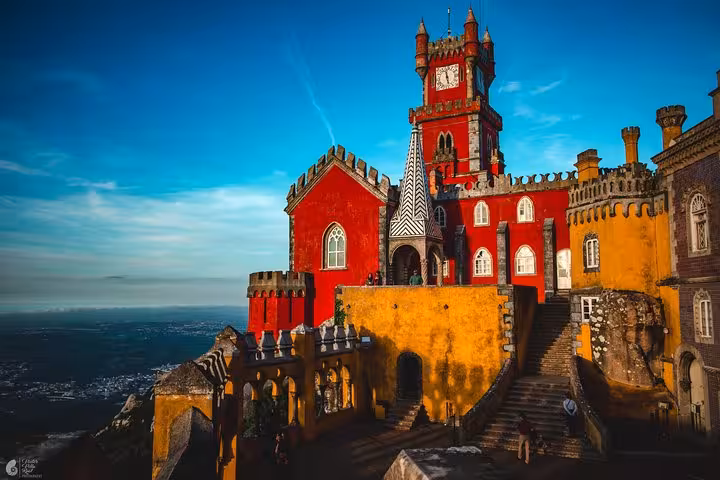 Colorful Pena Palace in Sintra on a self-drive tour, panoramic views over hills and Atlantic coast