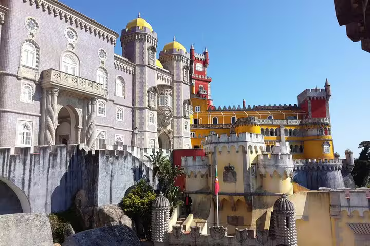 Vibrant Pena Palace in Sintra, with its colorful architecture, featured on Private Fatima Sintra Tour from Lisbon or Cascais.