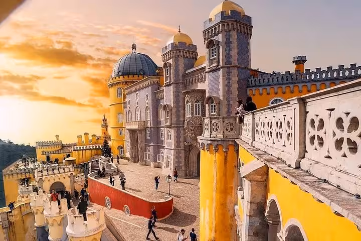 Pena Palace at sunset in Sintra, Portugal, a highlight of the self-drive tour to monuments and Atlantic coast