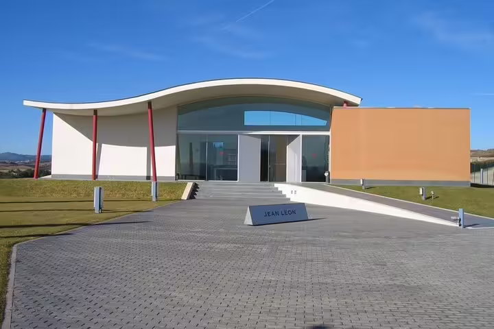 Modern architecture of a winery in Penedés, showcasing a sleek design as part of the wine cellar tour.