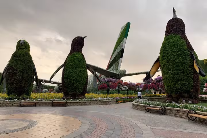 Giant penguin topiary display at Dubai Miracle Garden, popular UAE day trip with ticket/pass adventure