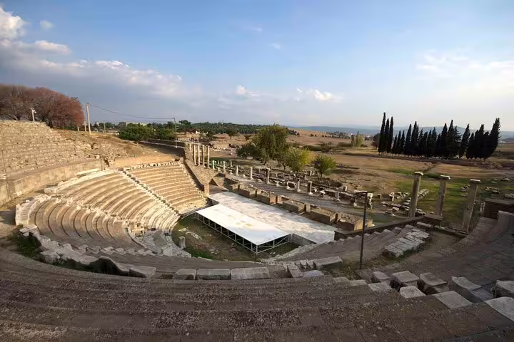 Ancient amphitheater of Pergamon under a clear sky, featured in the Pergamon & Asclepion Tour from Kusadasi & Selcuk.