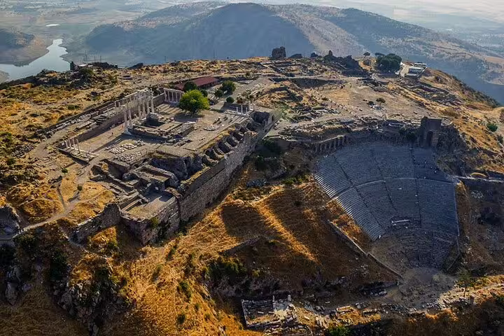 Aerial view of Pergamon's ancient ruins and amphitheater, highlighting historical grandeur on a guided tour.