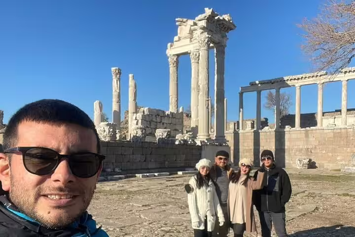 Visitors at the majestic ruins of Pergamon on the 7 Churches of Revelation Tour, capturing history and culture.