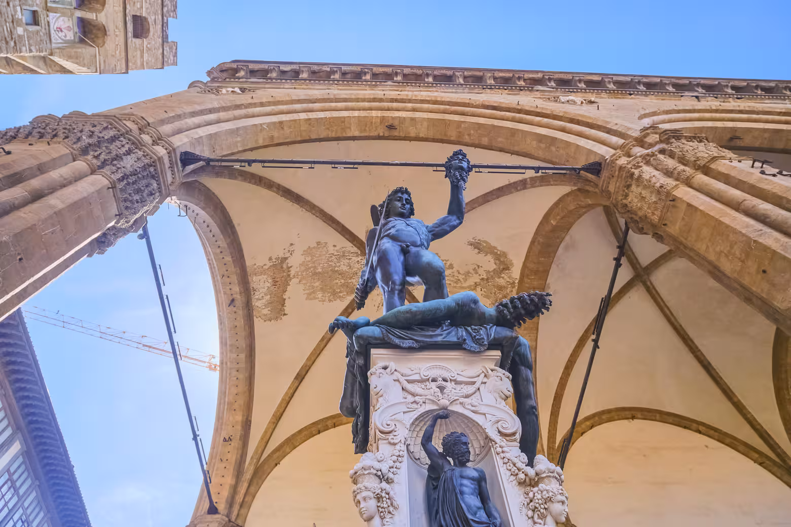 Perseus with the Head of Medusa statue under arches at Loggia dei Lanzi on Florence monolingual tour.