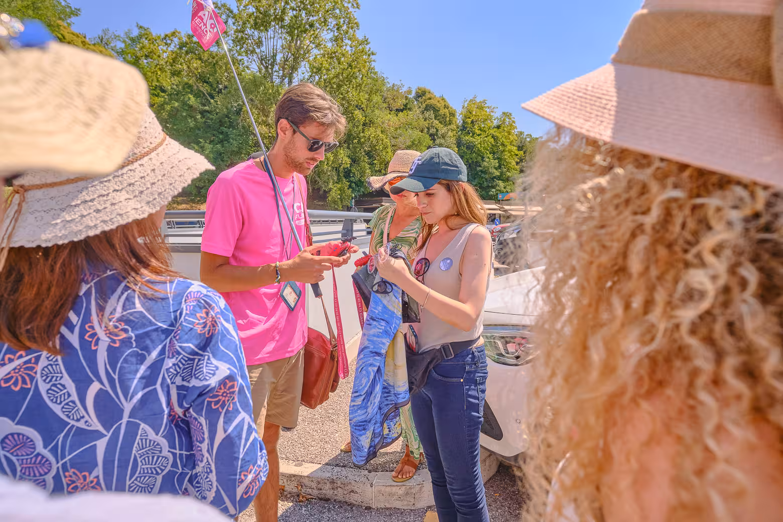 Tour group listens attentively to their guide in Assisi, capturing the essence of Umbria's historic allure.