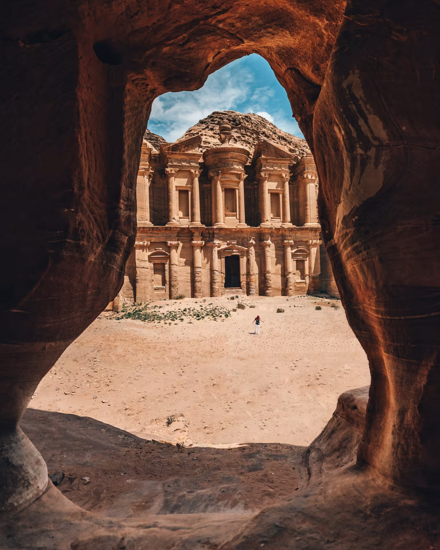 Petra Monastery (Ad Deir) framed by a rock arch, Timeless Jordan tour exploring Jordan’s UNESCO wonders