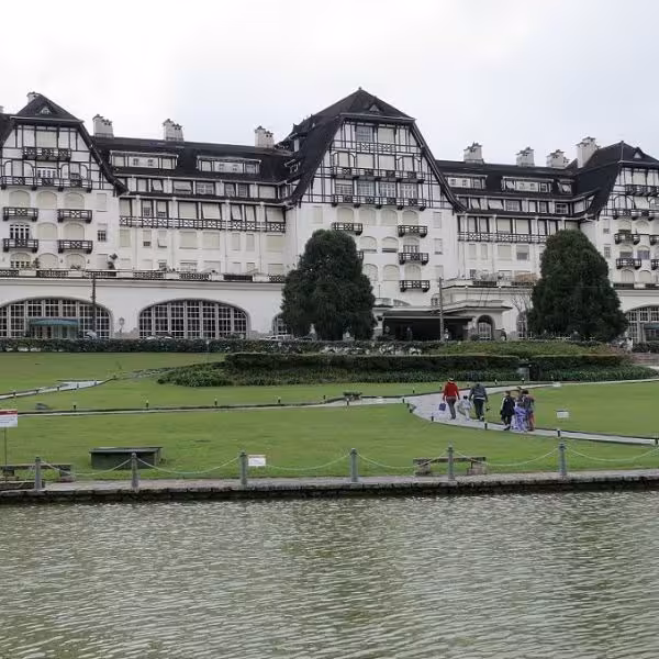Grand historic hotel with European architecture and lush gardens in Petrópolis, ideal for cultural tours.