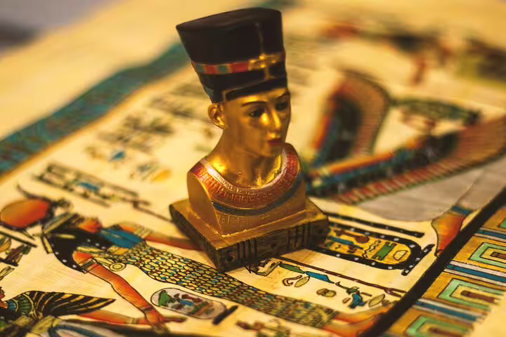 Golden pharaoh bust souvenir on papyrus art, a classic find on the Medieval Cairo bazaars shopping tour