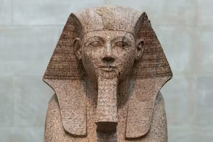 Ancient pharaoh statue at the Egyptian Museum Cairo, highlight of Giza Pyramids day tour with camel ride