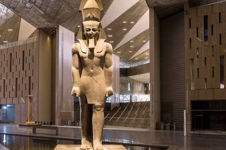 Colossal pharaoh statue inside Grand Egyptian Museum, Cairo on full-day Hurghada to Pyramids trip