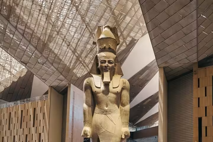Colossal pharaoh statue inside the Grand Egyptian Museum Cairo, featured on Sharm El Sheikh pyramids tour