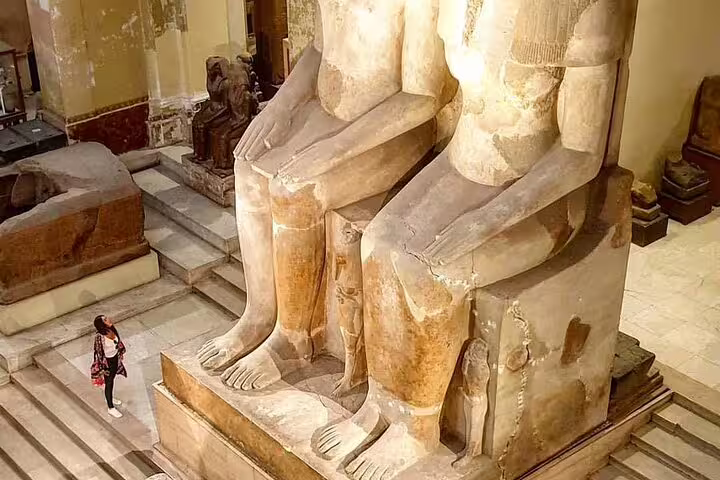 Colossal seated pharaoh statues in Cairo Egyptian Museum on a private half-day guided tour