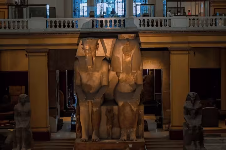 Twin seated pharaoh statues in Egyptian Museum Cairo, highlight of Hurghada to Cairo pyramids tour