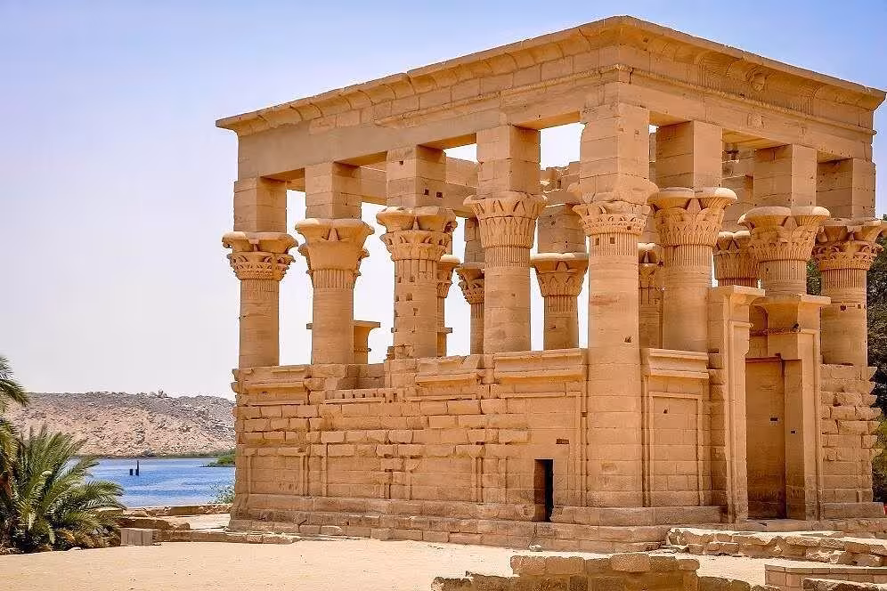 Philae Temple in Aswan with carved columns by the Nile, highlight of the Aswan city tour in Egypt
