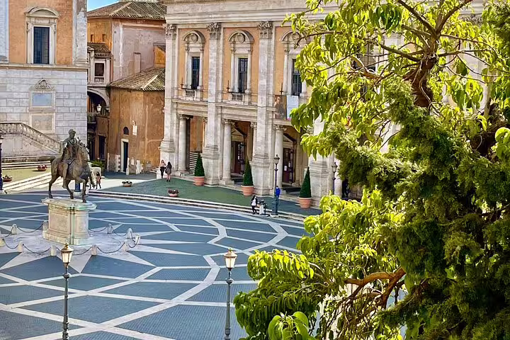 Panoramic view of Piazza del Campidoglio near the Roman Forum, with statues and Renaissance palaces on a Rome Colosseum hilltop tour