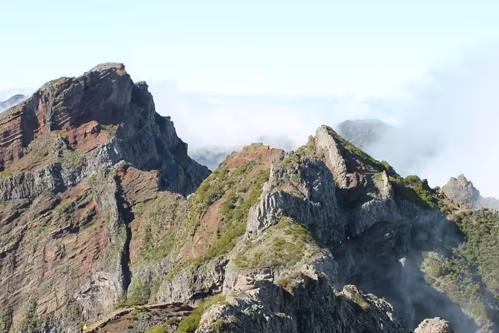 Stunning ridged peaks of Pico do Arieiro under a clear sky, perfect for a self-guided sunrise hike in Madeira.